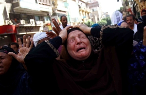 Egyptian woman mourns following verdict sentencing 683 alleged supporters of Muslim Brotherhood to death (Photo: AP)